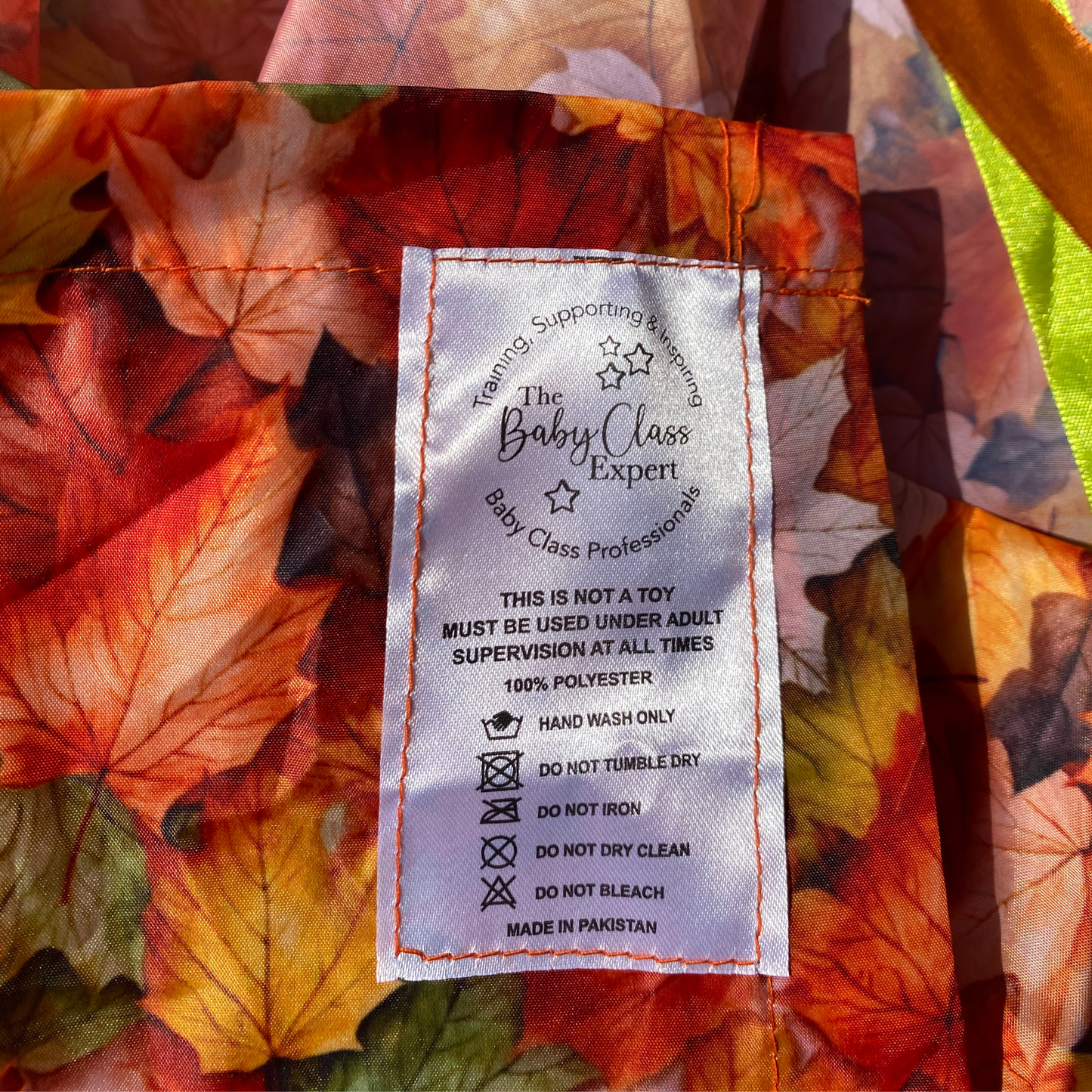 Autumn Sensory Parachute product label showing The Baby Class Expert logo and product care instructions