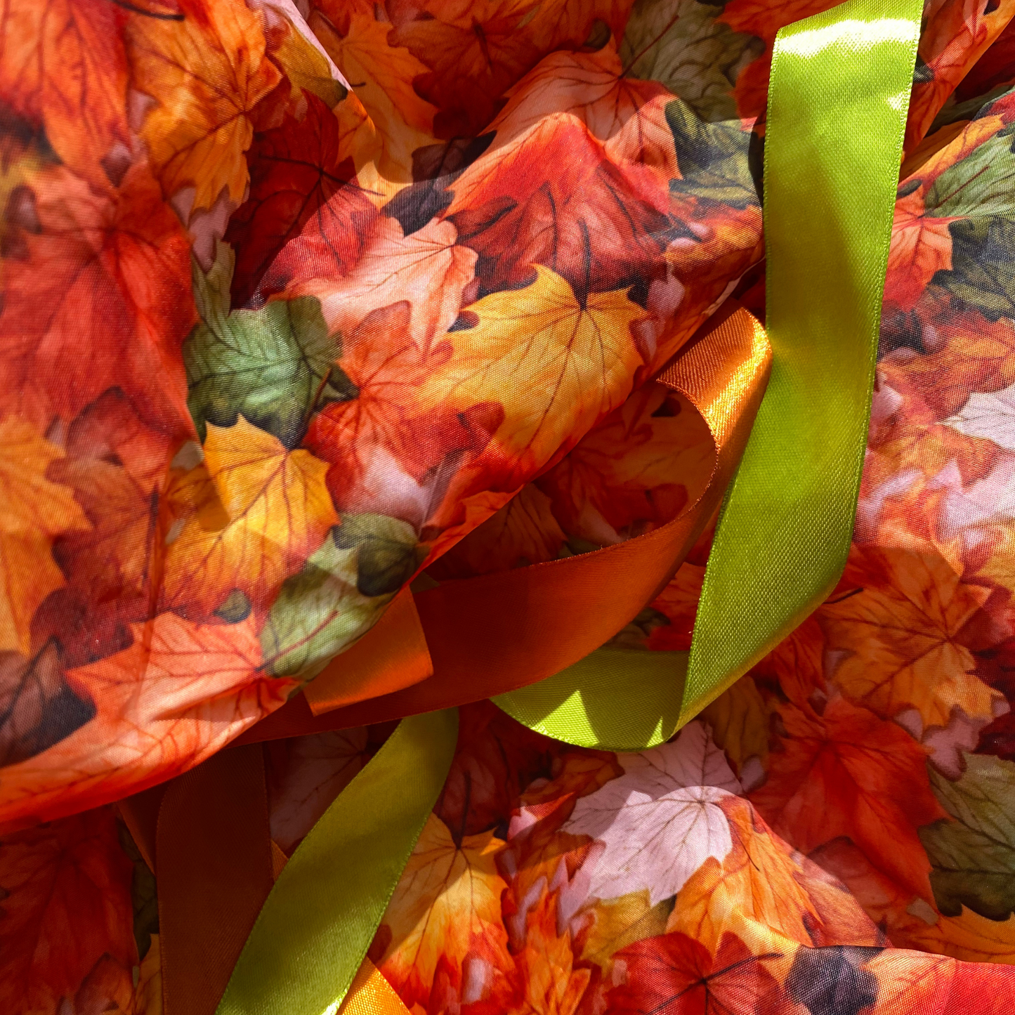 Autumn Sensory Parachute with green and orange and golden ribbons