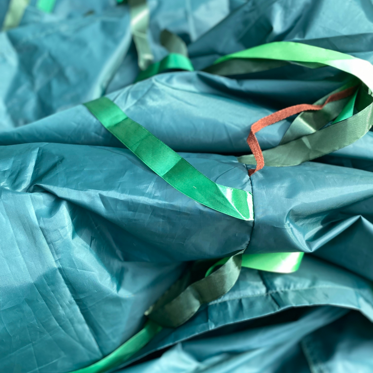 Close up of Jungle green Sensory Parachute and green and brown ribbons