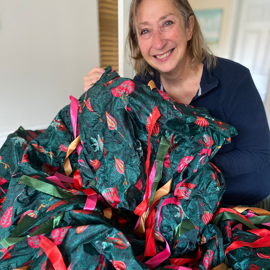 Underneath the Christmas Tree Sensory Parachute — 3 metre green sensory parachute with Christmas tree branches and baubles print and over 200 ribbons for baby sensory classes.