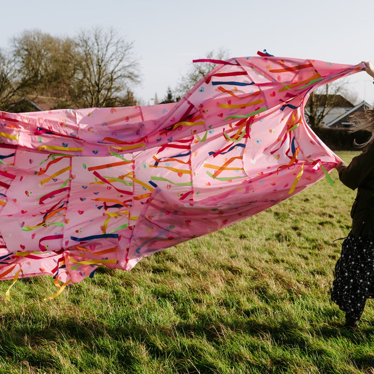 Love is in the Air pink Sensory Parachute with over 200 ribbons flowing in the wind, ideal for sensory baby and toddler classes