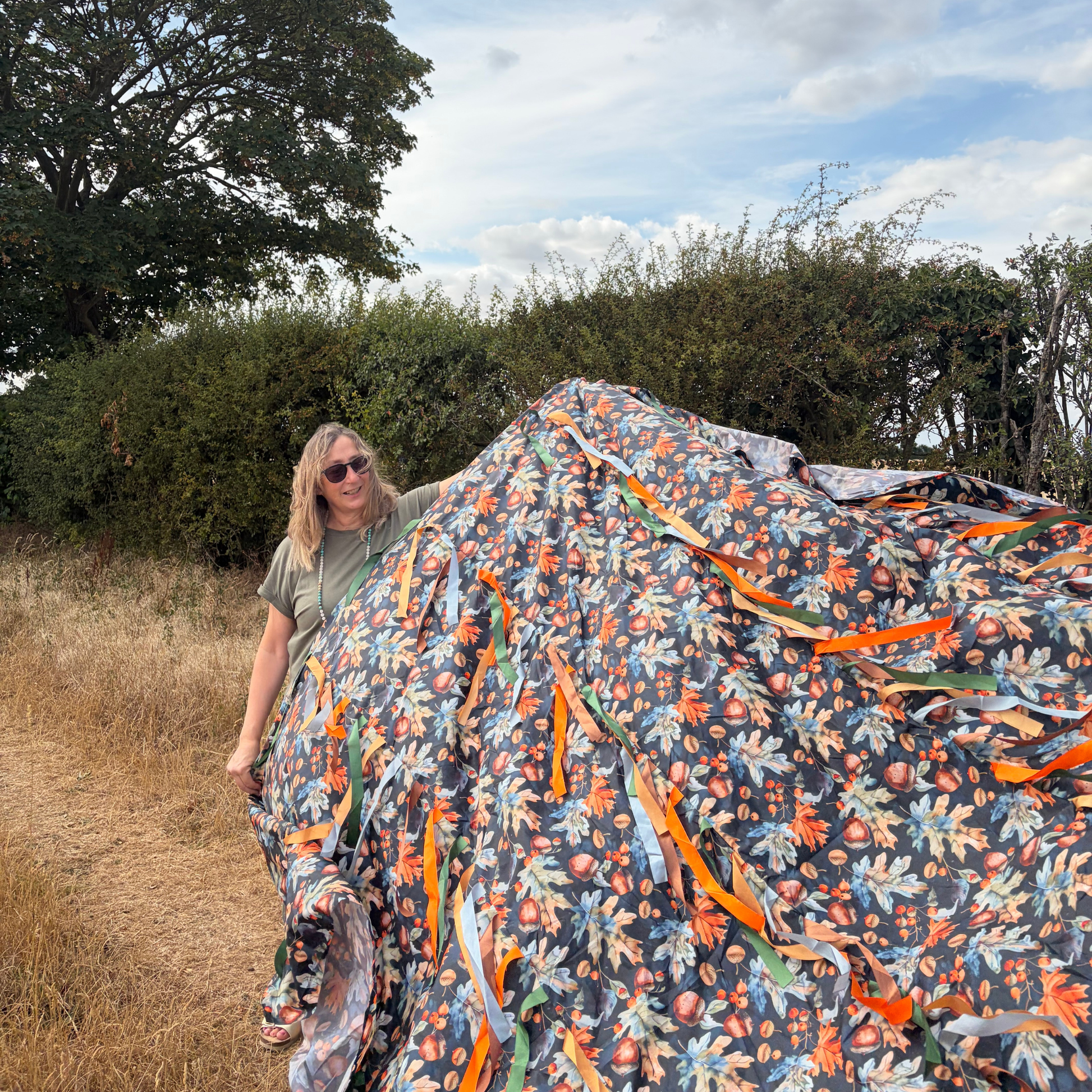 oaks and acorns sensory parachute held by Elizabeth James, the baby class expert