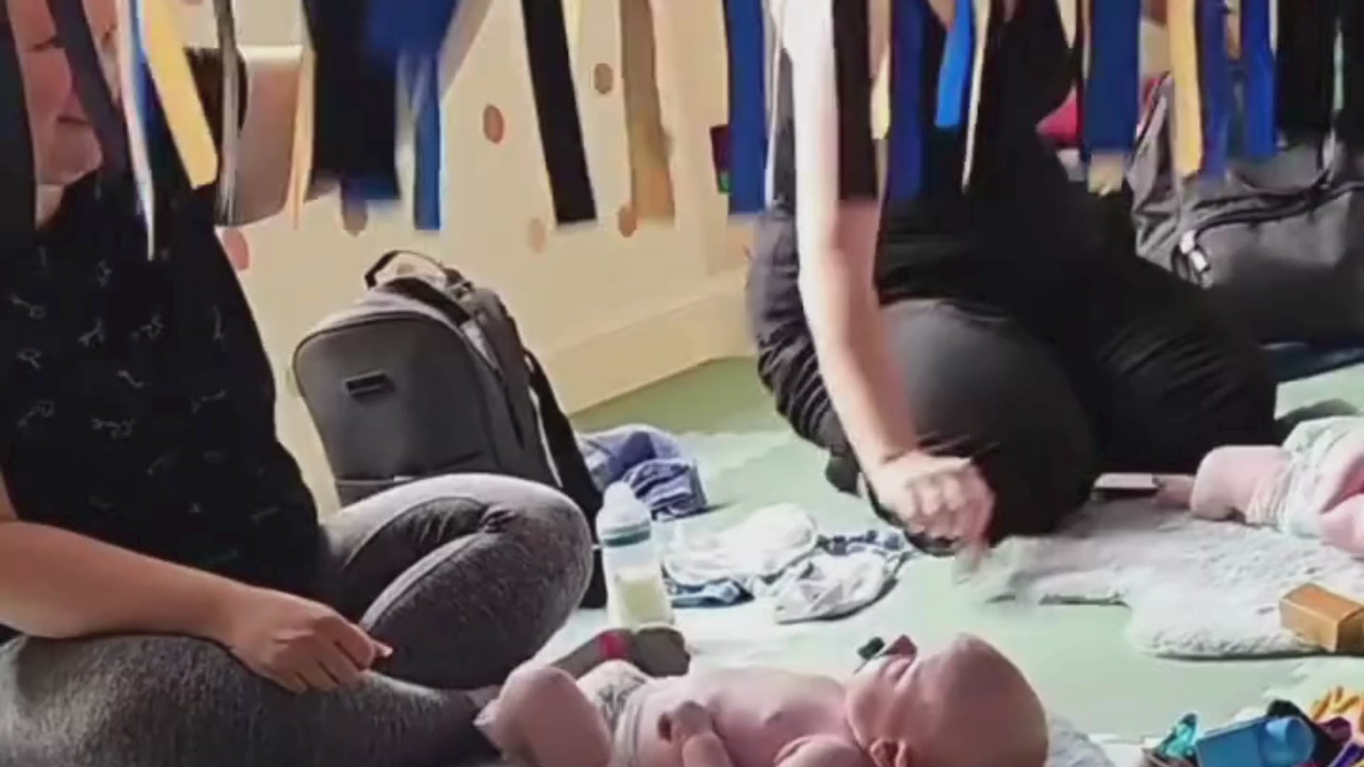 Load video: Rainbow, Starry Night, and Black &amp; White Sensory Parachutes in motion, ribbons flowing to create magical sensory experiences in baby classes.
