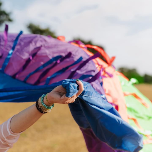 Detailed view of blue section of the rainbow sensory parachute, showing strong seams and quality stitching.